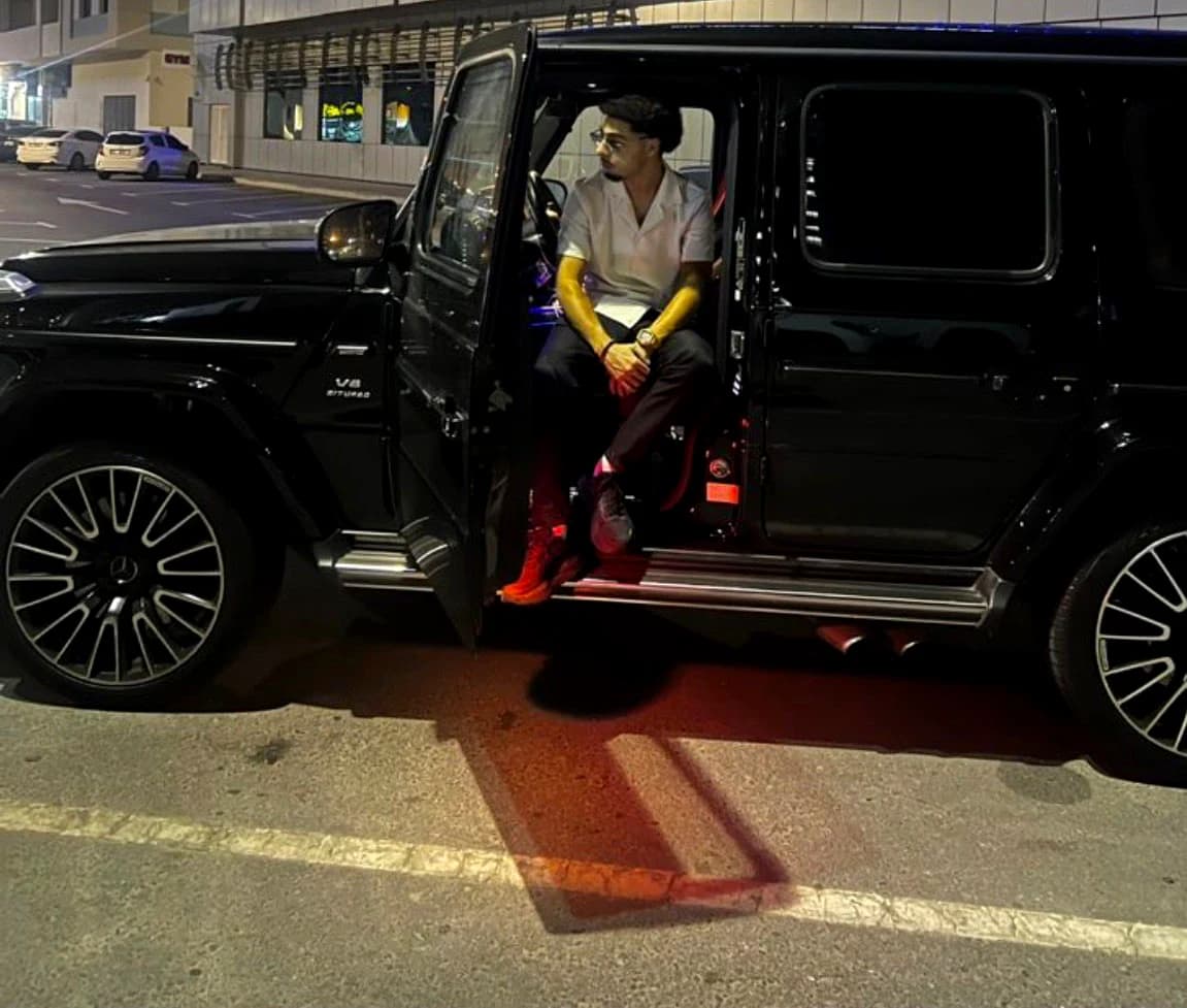 Rvsan sitting in his G63 in Dubai